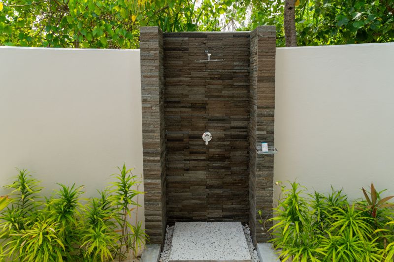 Open Concept Shower with Natural Stone Tiles